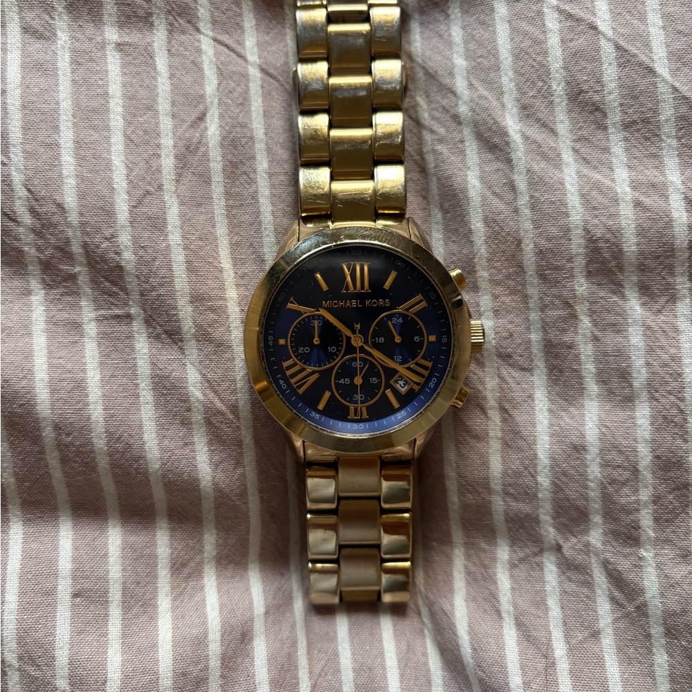 Michael Kors women’s watch with Gold Band and Blue Dial